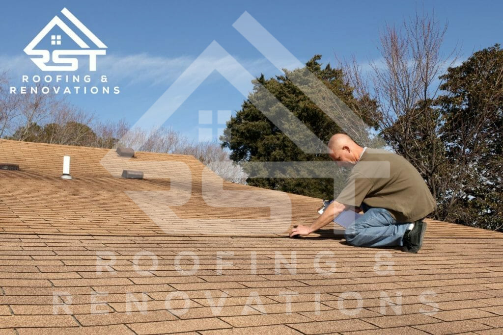Professional Roofer Inspecting Shingles On Residential Roof Repair Project